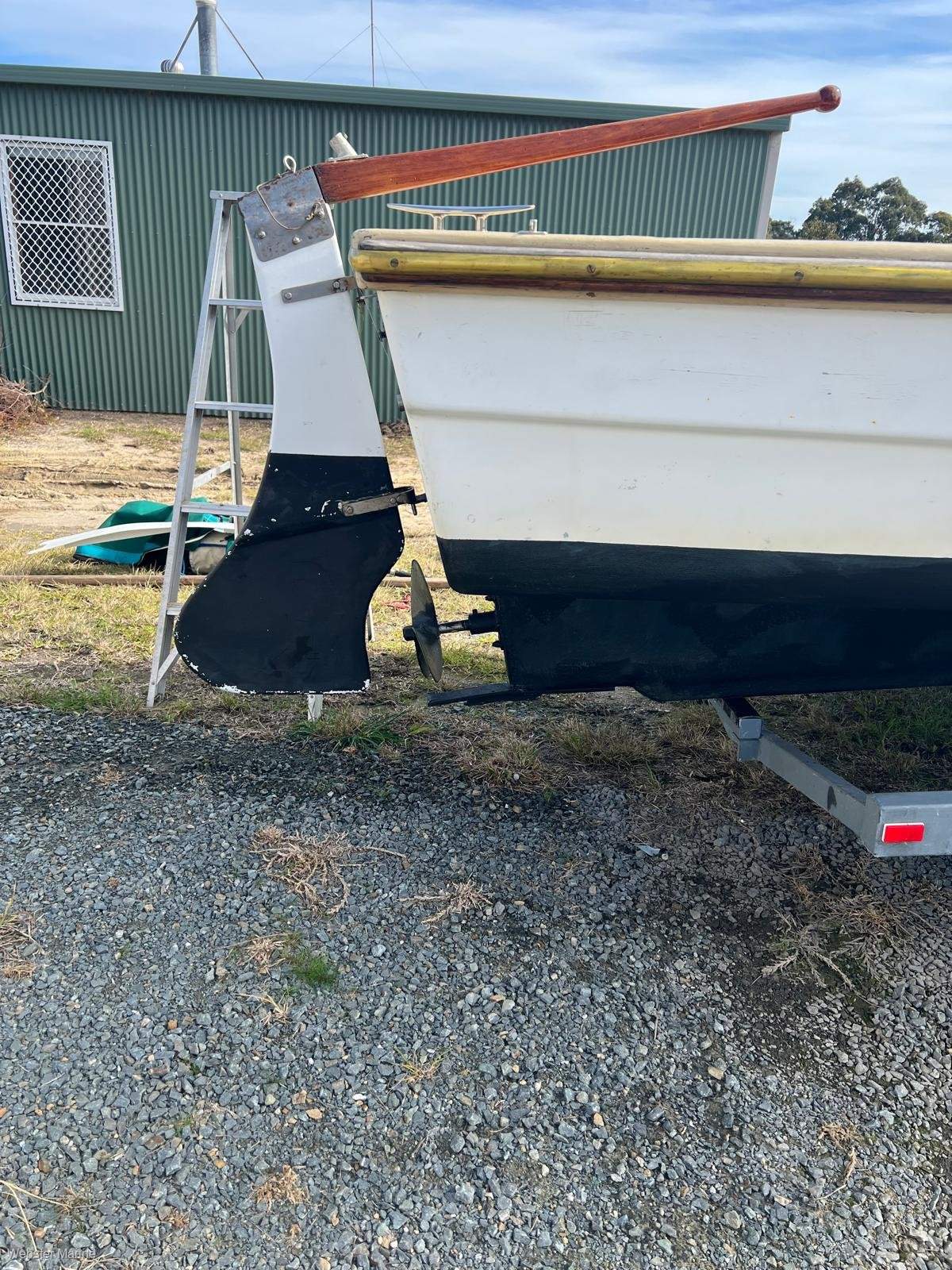 Custom fibreglass fishing boat on trailer