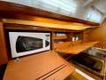 Beneteau Cyclades 43.3 Stylish, air conditioned 3-cabin coastal cruiser:Microwave and crockery supplied