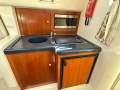Sunrunner 3300 Sports Cruiser " Port Coogee Pen conditions apply ":Galley with Corian Bench top