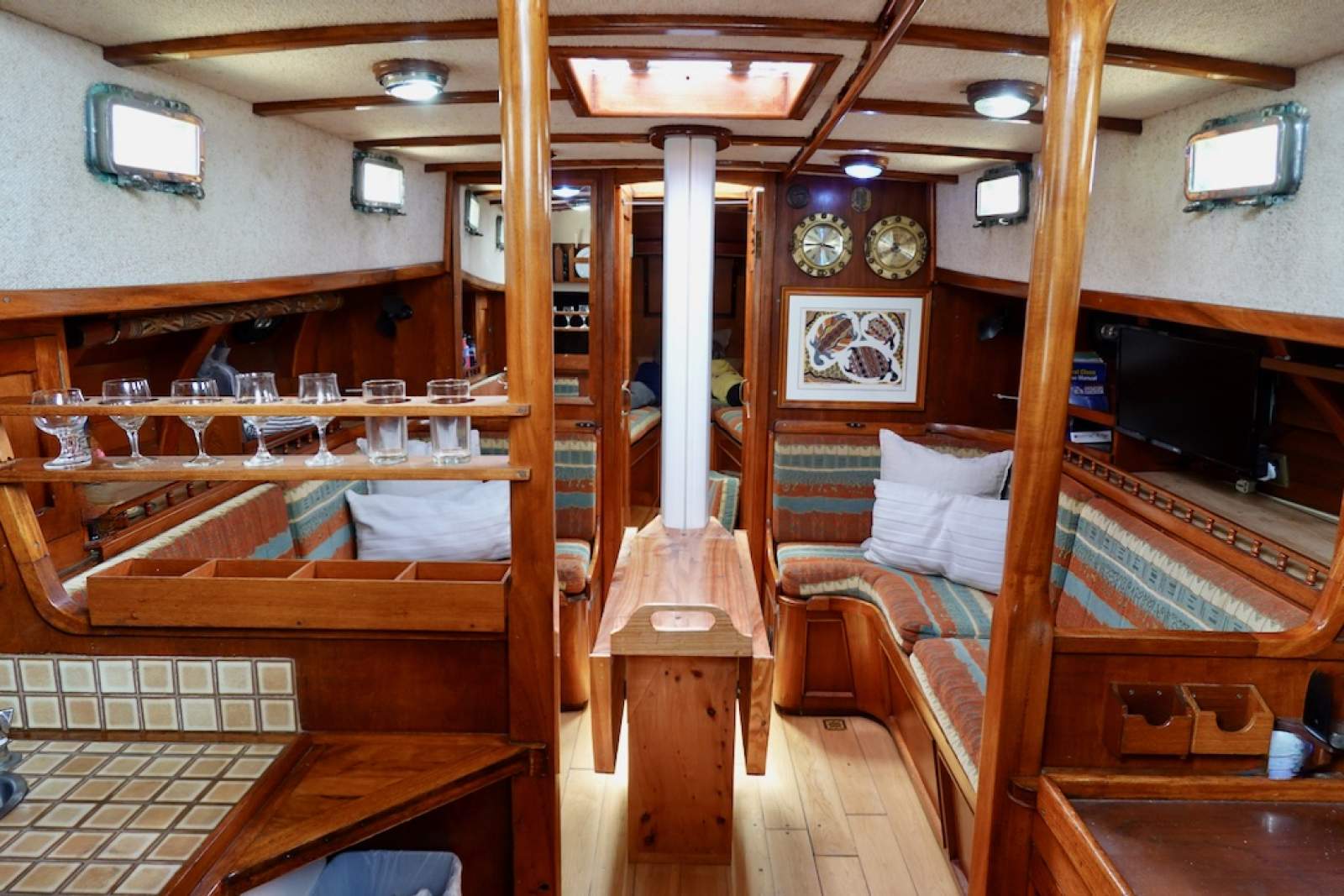Adams 40CC Round bilge, Steel, Proven global cruiser:Main saloon with custom folding table that can fold away at the mast for extra room