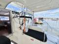 Leopard Catamarans L39pc 2012:Helm station and rear deck, starboard side.
