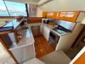 Caribbean 47 Flybridge Cruiser with Only 447 Hours
