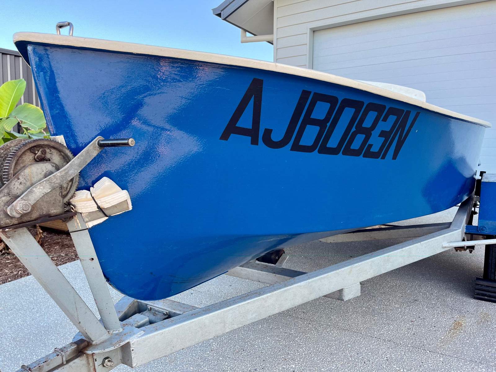 Classic beautiful old timber boat with trailer