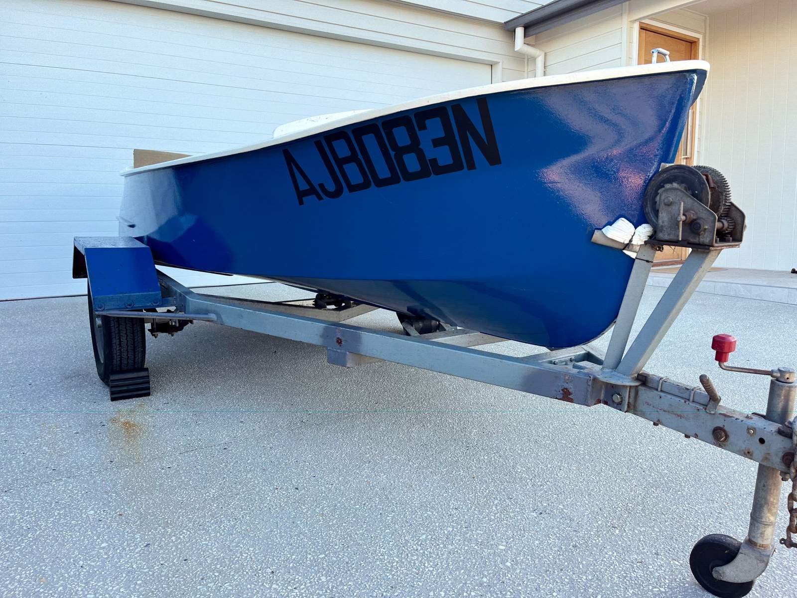 Classic beautiful old timber boat with trailer
