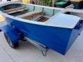 Classic beautiful old timber boat with trailer