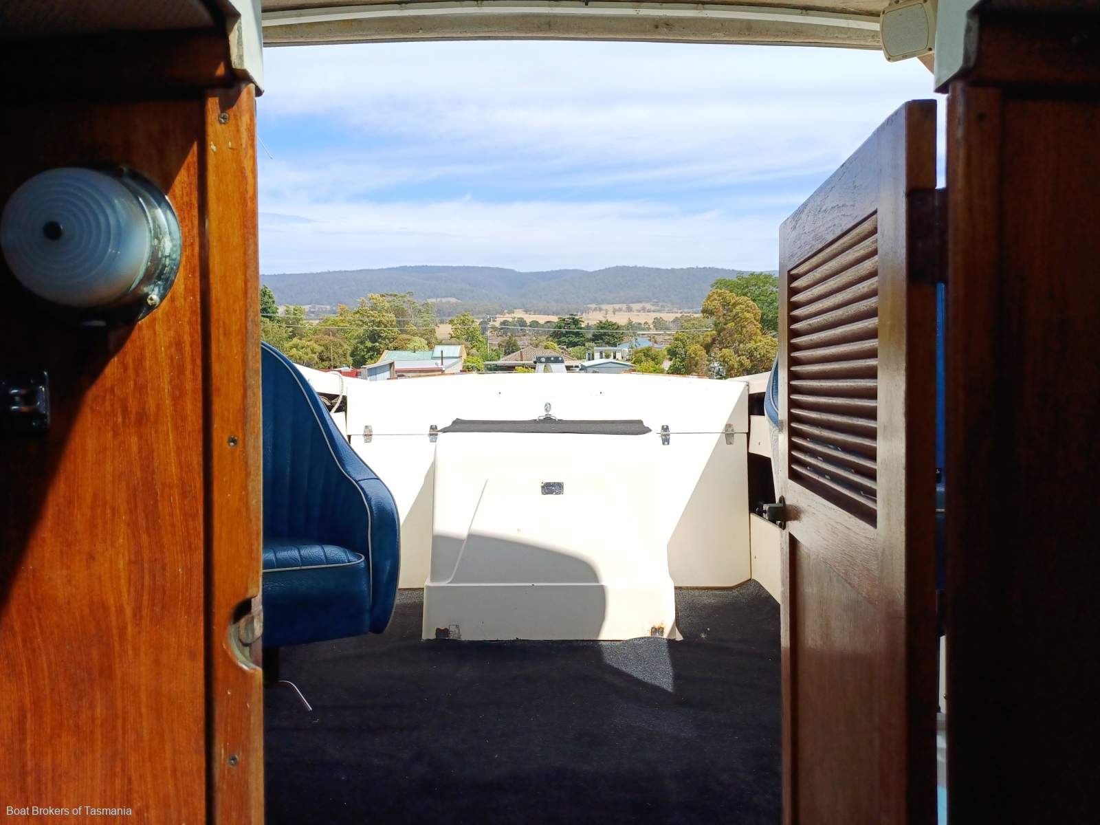 Caribbean Reef Runner 21. Only 7 engine hours on late model Mercruiser. Boat Brokers of Tasmania