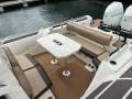 Brig Eagle 10 " BOATHOUSE STORAGE AVAILABLE ":Onboard view of Lounges and Table
