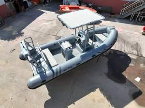 Custom 5.8 meter center console RIB w/aluminium:T-top with fishing rod holders