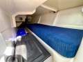 Eureka 10.4 Sports -Affordable & well-equipped 2-hander Racer-Cruiser:Port aft quarter berth with 12v fridge, reading lamp and access to quadrant