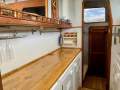 Simpson Cloud 12 Re-powered, re-rigged, superbly presented cruiser:Starboard hull galley with excellent storage and utensils