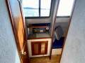 Simpson Cloud 12 Re-powered, re-rigged, superbly presented cruiser:Port companionway (head aft - nav station forward)