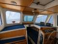 Bruce Roberts 40 Roberts 40 Pilot House:Helm from inside out of the weather