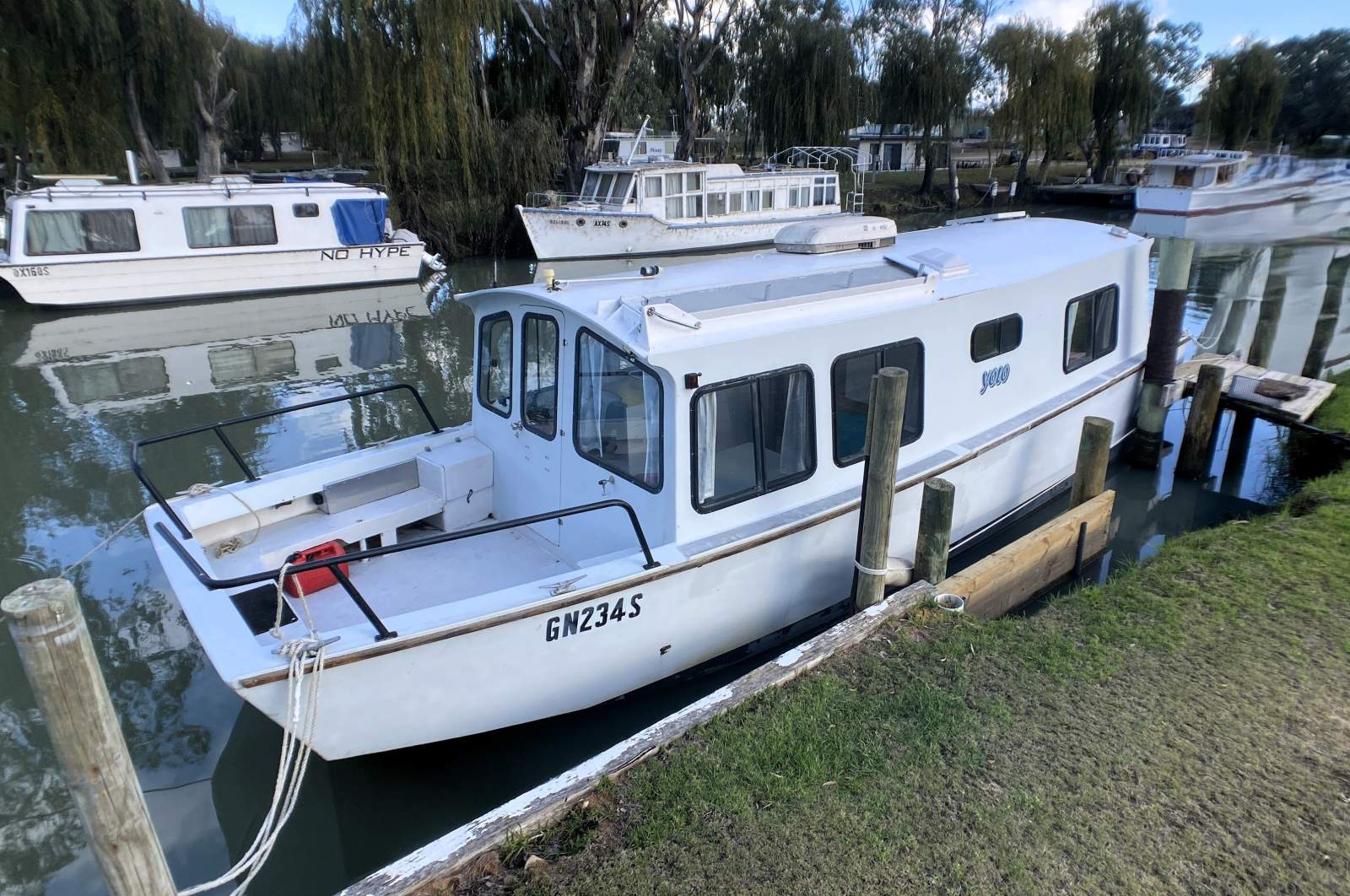 "YOLO". Trailerable Houseboat, One Bed, One Bath.