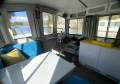 "YOLO". Trailerable Houseboat, One Bed, One Bath.