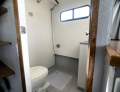 "YOLO". Trailerable Houseboat, One Bed, One Bath.