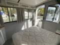 "YOLO". Trailerable Houseboat, One Bed, One Bath.