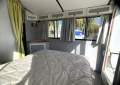 "YOLO". Trailerable Houseboat, One Bed, One Bath.