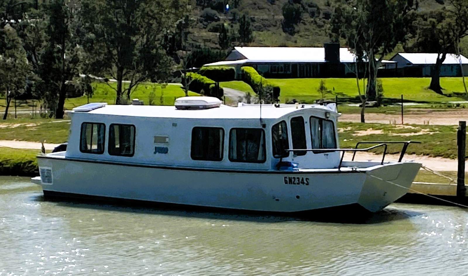 "YOLO". Trailerable Houseboat, One Bed, One Bath.