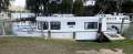 "YOLO". Trailerable Houseboat, One Bed, One Bath.