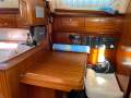 Bavaria Cruiser 41 - Upgraded for liveaboard coastal cruising:Nav Station with switch panel Icom VHF / Starlink 