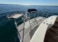 Caribbean 49 Flybridge Cruiser:Big swim board with rails