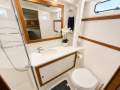 Caribbean 49 Flybridge Cruiser:FWD master bathroom
