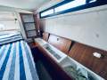 Riviera 40 Aft Cabin " GENUINE LOW ENGINE HOURS ":Aft Cabin Port side storage