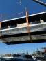 Custom:vessel being lifted into the water Hulls only for sale