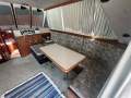 Randell 41 Mk II Flybridge Sports Fisher " DUAL HELM, DUAL SHAFT DIESELS ":Starboard side dinning table and lounge