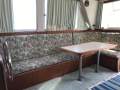 Randell 41 Mk II Flybridge Sports Fisher " DUAL HELM, DUAL SHAFT DIESELS ":Starboard side dinning table and lounge